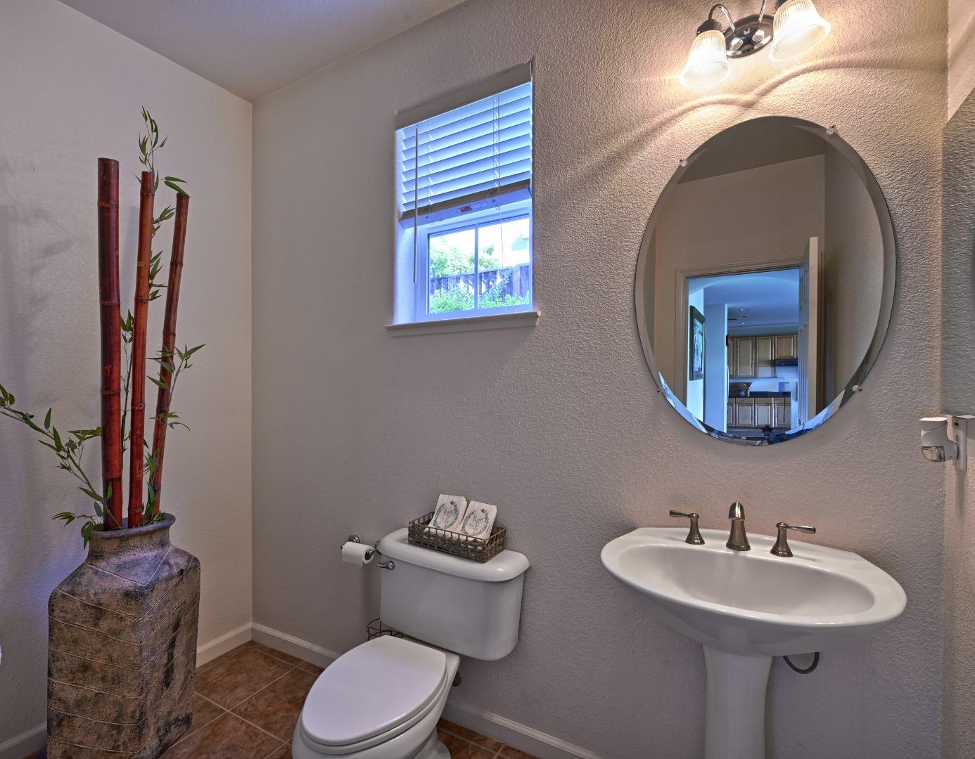 4190 Peninsula Point Drive Seaside, CA 93955 - Photo 11 of 30 a bathroom with a toilet sink and mirror