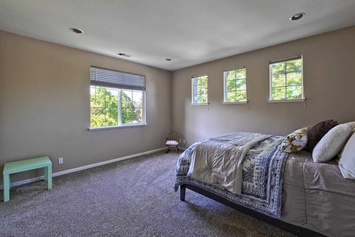4190 Peninsula Point Drive Seaside, CA 93955 - Photo 13 of 30 a bed sitting in a bedroom next to a window