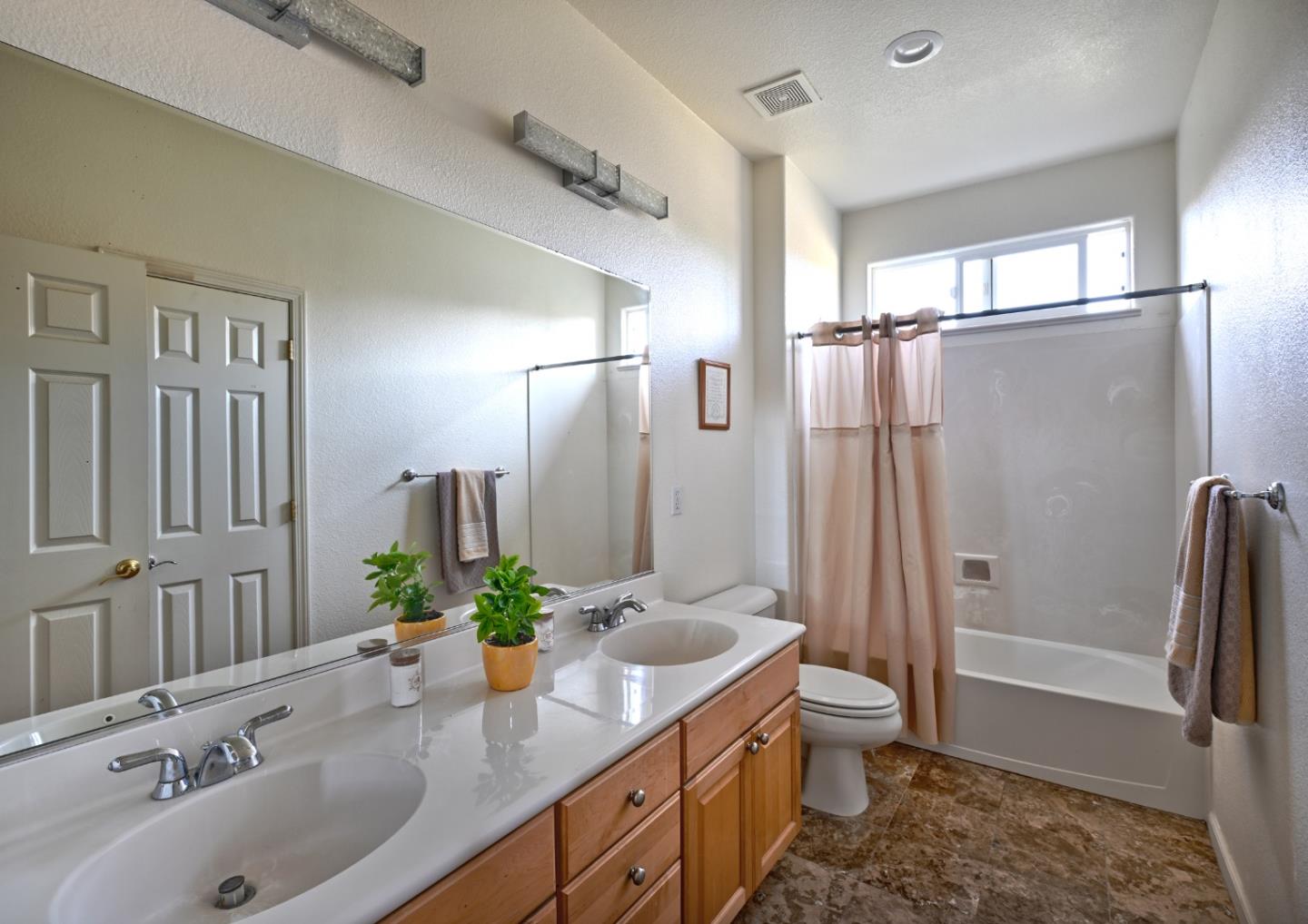 4190 Peninsula Point Drive Seaside, CA 93955 - Photo 14 of 30 a bathroom with a double vanity sink toilet and shower