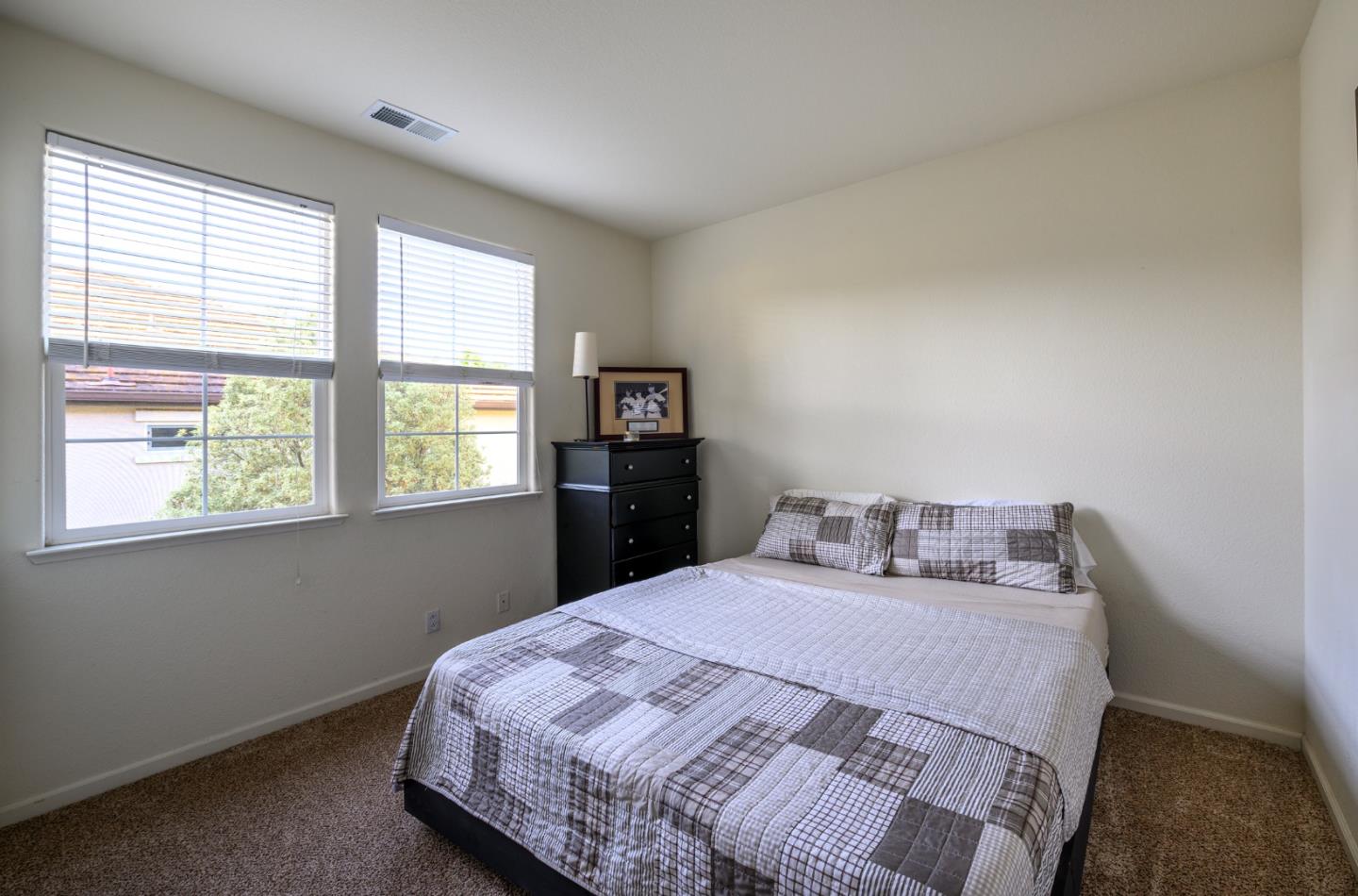 4190 Peninsula Point Drive Seaside, CA 93955 - Photo 15 of 30 a bedroom with a bed and a window