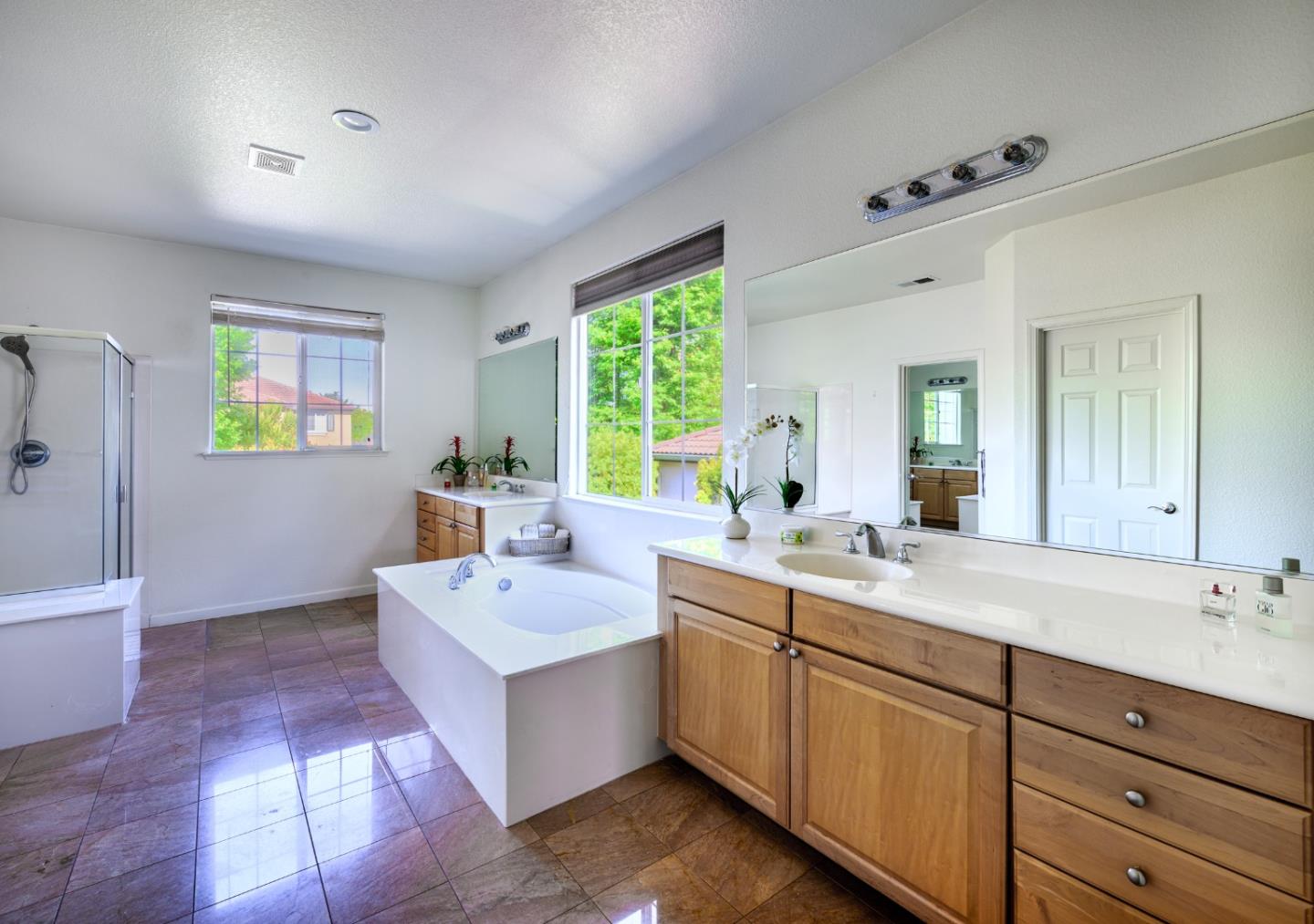 4190 Peninsula Point Drive Seaside, CA 93955 - Photo 18 of 30 a spacious bathroom with a double vanity sink a mirror and a bathtub