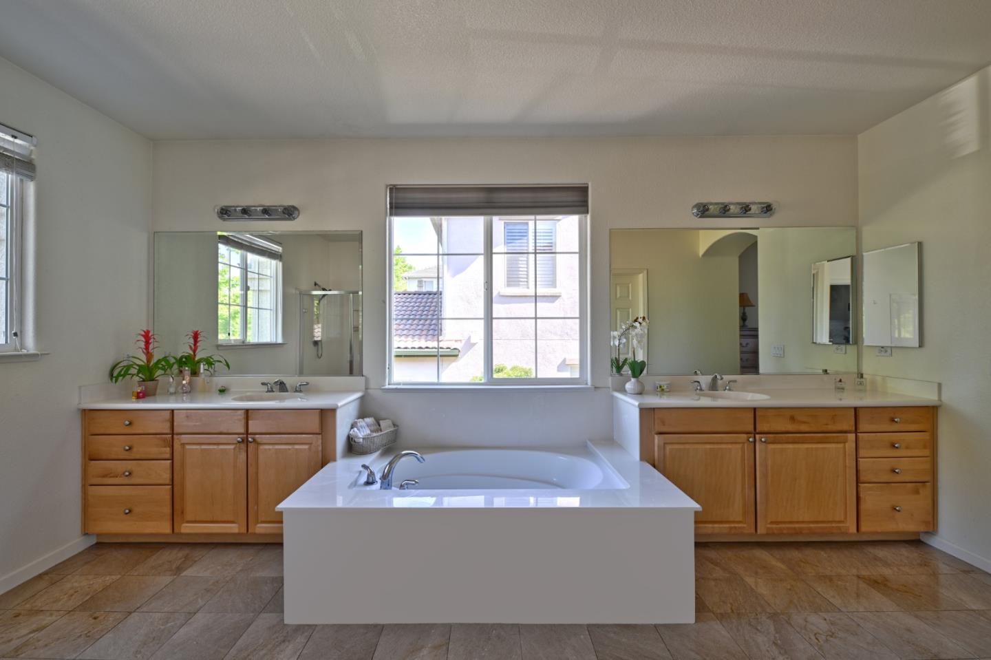 4190 Peninsula Point Drive Seaside, CA 93955 - Photo 19 of 30 a spacious bathroom with a tub sink and mirror