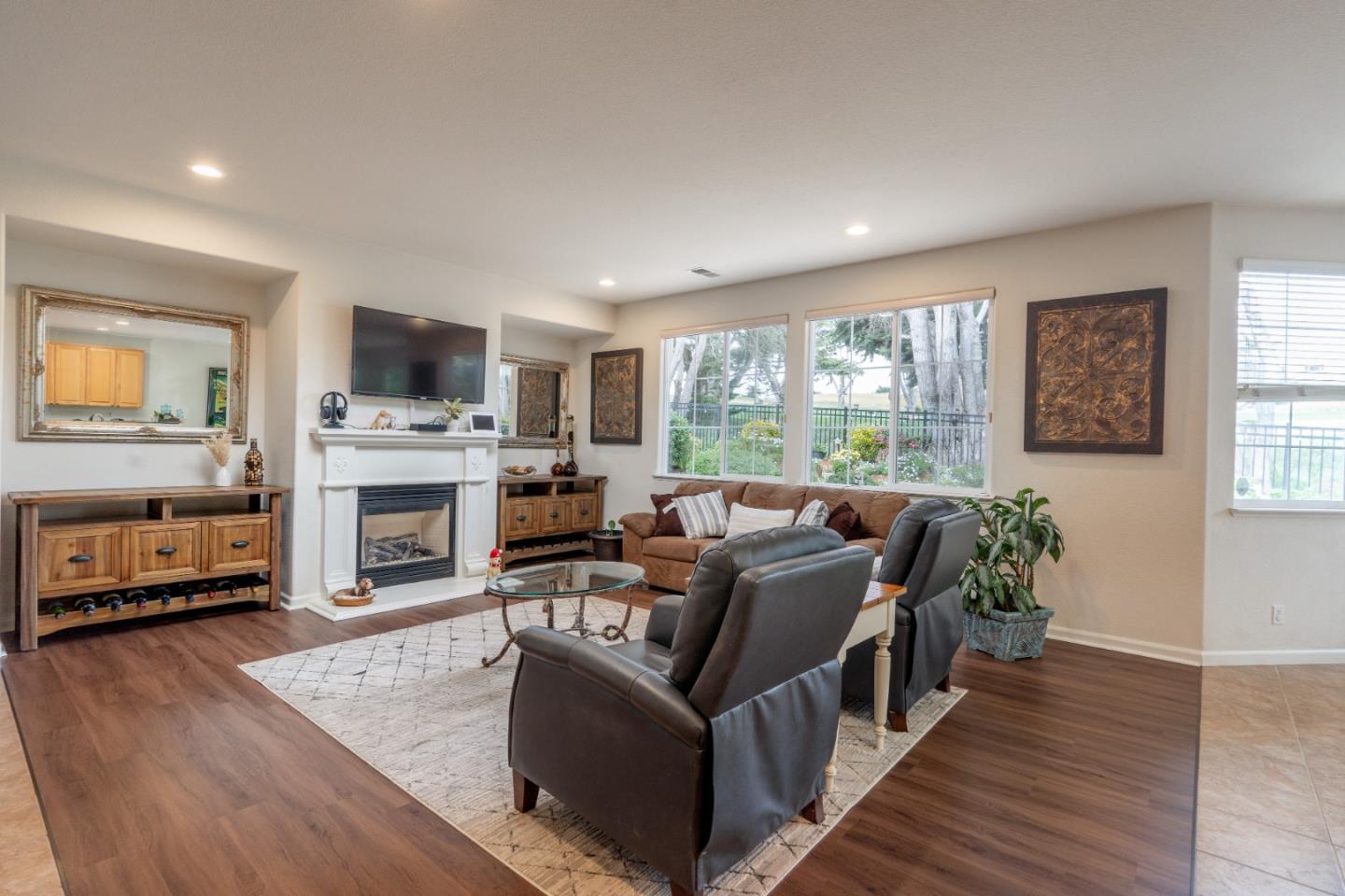 4190 Peninsula Point Drive Seaside, CA 93955 - Photo 8 of 30 a living room with fireplace furniture and a flat screen tv