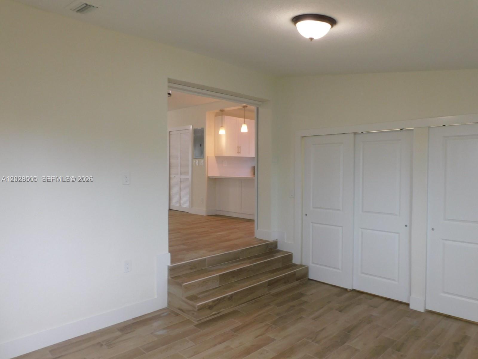 3333 Southwest 89th Avenue Miami, FL 33165 - Photo 13 of 44 Same wood floors throughout the entire home.