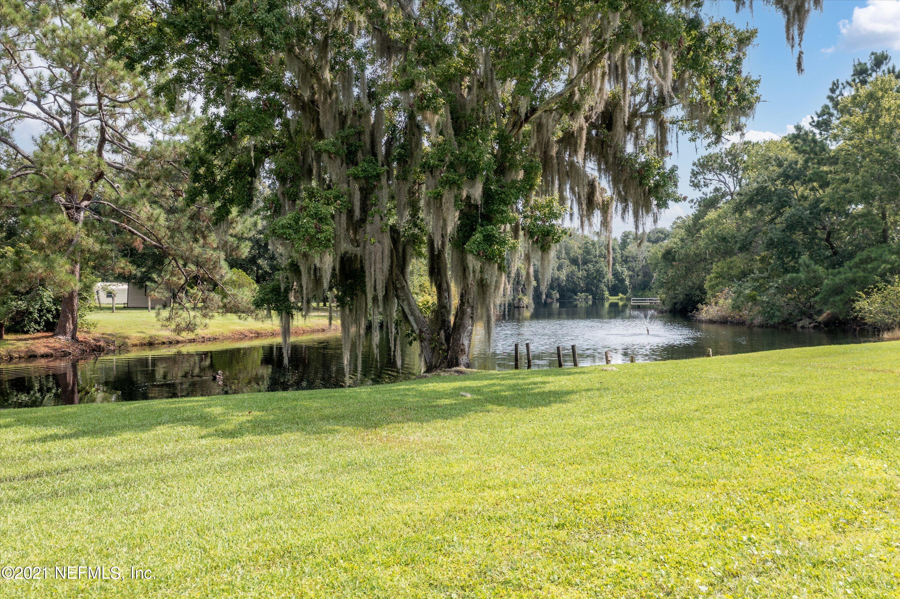 241 Holly Knowe Road Fleming Island, FL 32003 - Photo 26 of 28 Backyard to lake