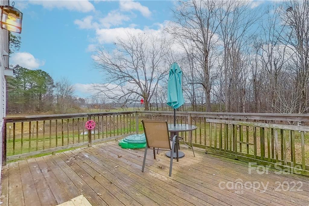 3701 Parkwood School Road Monroe, NC 28112 - Photo 11 of 36 a view of balcony with wooden floor and fence