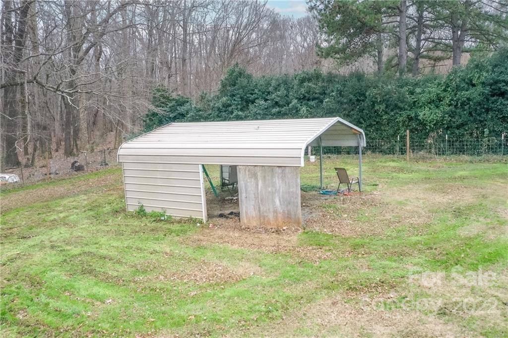 3701 Parkwood School Road Monroe, NC 28112 - Photo 14 of 36 a view of a house with a yard and tree