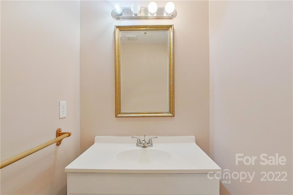 3701 Parkwood School Road Monroe, NC 28112 - Photo 15 of 36 a bathroom with a sink and a mirror