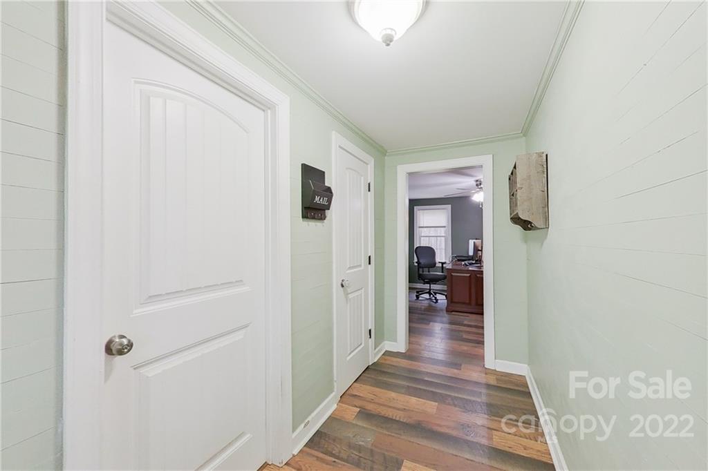 3701 Parkwood School Road Monroe, NC 28112 - Photo 16 of 36 a view of a hallway view with wooden floor and living room