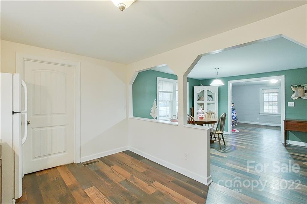 3701 Parkwood School Road Monroe, NC 28112 - Photo 20 of 36 wooden floor in a hall with an entryway and livingroom