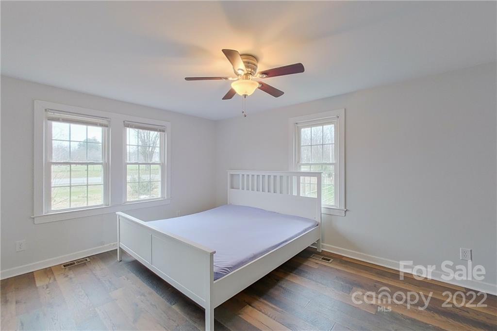 3701 Parkwood School Road Monroe, NC 28112 - Photo 25 of 36 a bedroom with a bed and a window