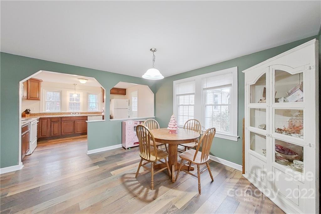 3701 Parkwood School Road Monroe, NC 28112 - Photo 29 of 36 a view of a dining room with furniture window and wooden floor