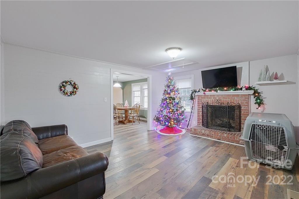 3701 Parkwood School Road Monroe, NC 28112 - Photo 31 of 36 a living room with furniture a flat screen tv and a fireplace
