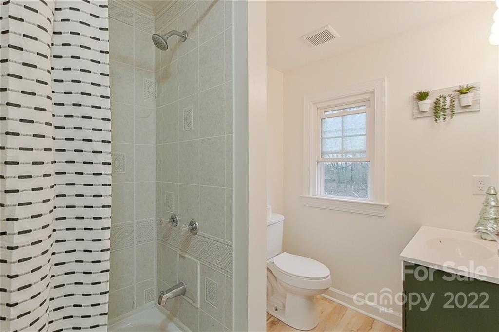 3701 Parkwood School Road Monroe, NC 28112 - Photo 34 of 36 a bathroom with a granite countertop sink toilet and shower