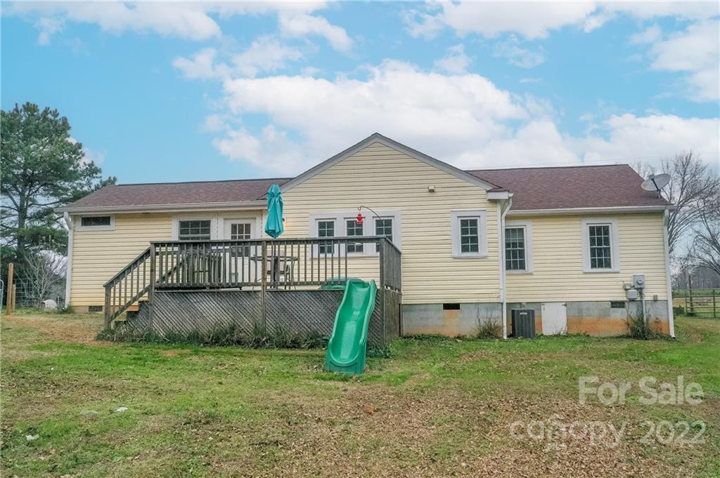 3701 Parkwood School Road Monroe, NC 28112 - Photo 9 of 36 a view of a house with a yard and a large tree