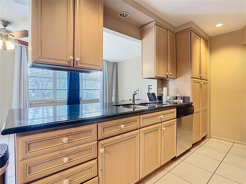 5964 Diana Road Venice, FL 34293 - Photo 12 of 27 a kitchen with stainless steel appliances granite countertop a sink and a cabinets