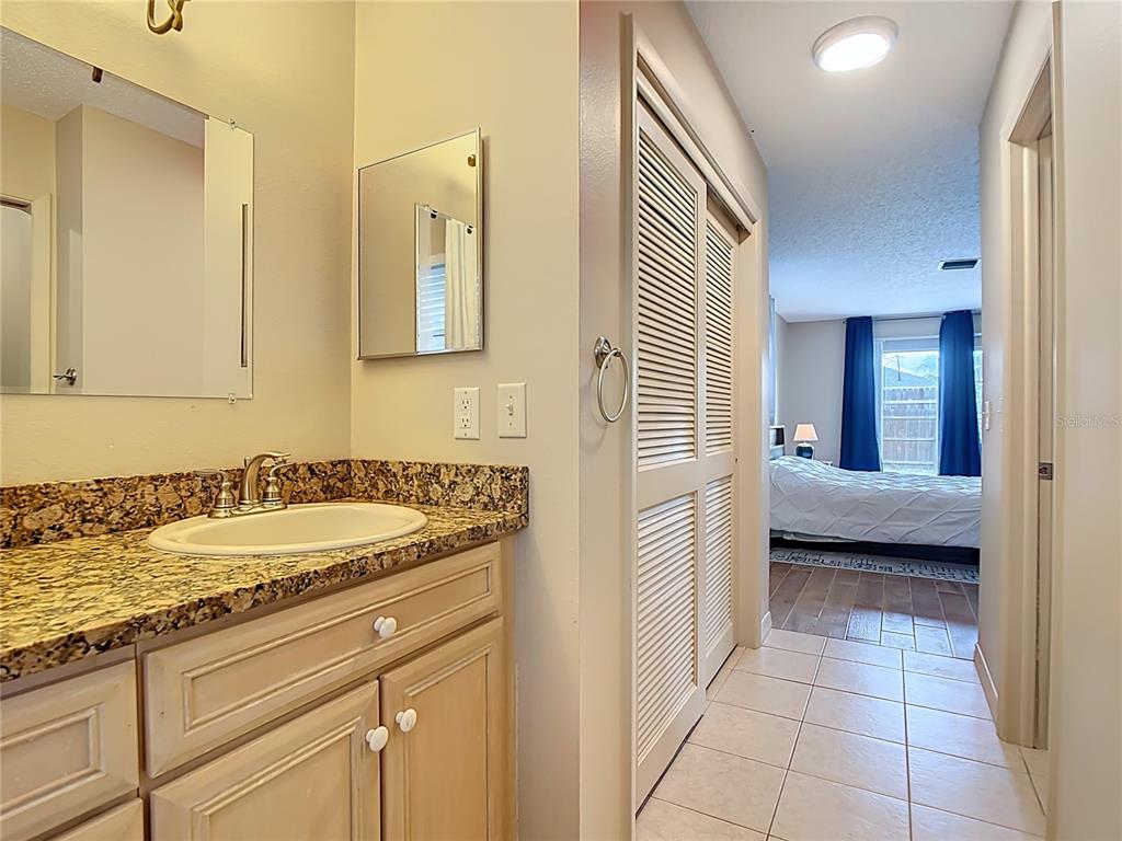 5964 Diana Road Venice, FL 34293 - Photo 24 of 27 a bathroom with a sink and a mirror