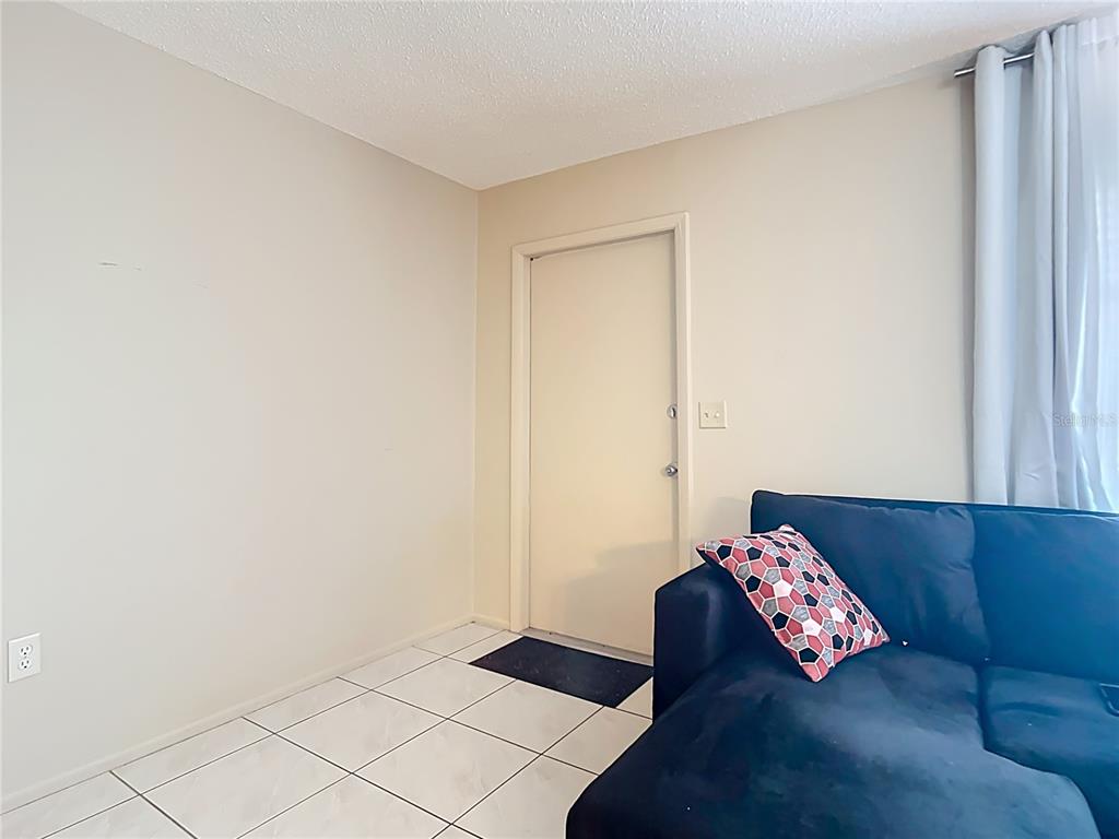 5964 Diana Road Venice, FL 34293 - Photo 4 of 27 a living room with a couch