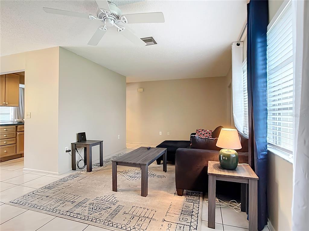 5964 Diana Road Venice, FL 34293 - Photo 6 of 27 a living room with furniture and decor