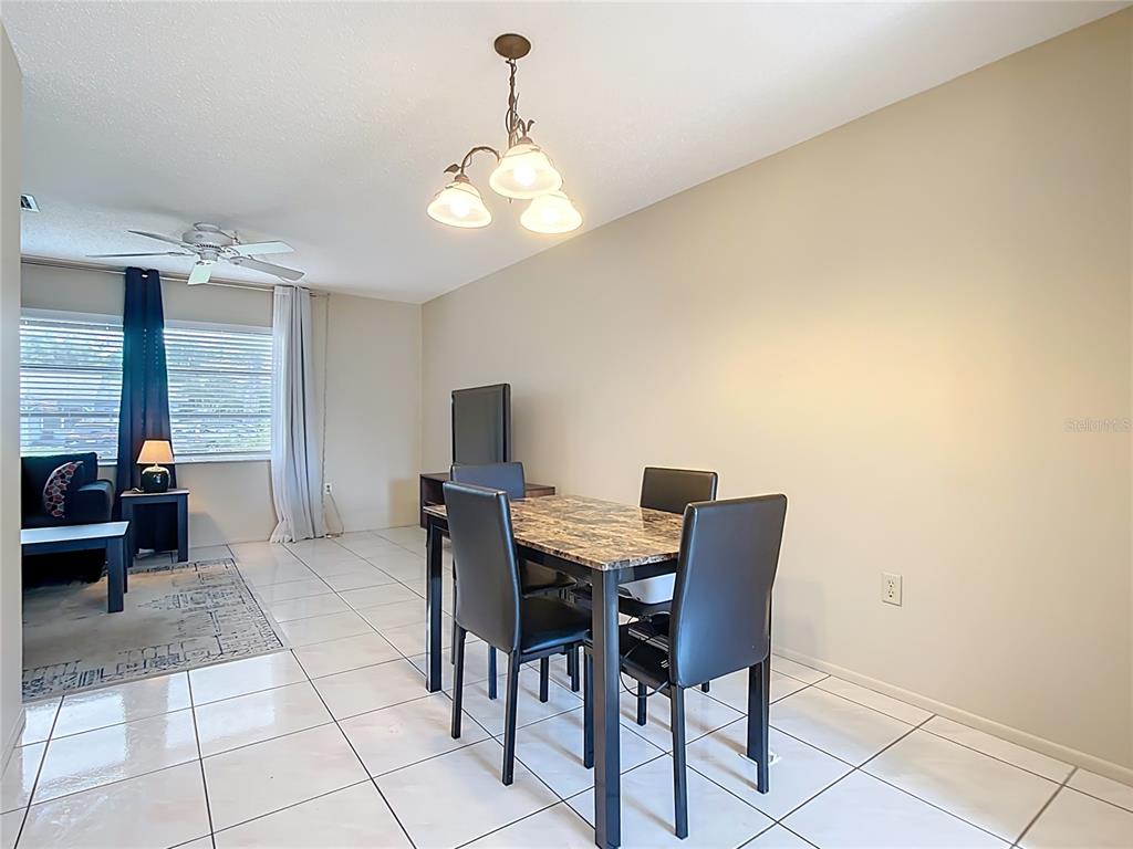 5964 Diana Road Venice, FL 34293 - Photo 8 of 27 a view of a dining room with furniture