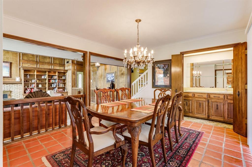 9310 Waterview Road Dallas, TX 75218 - Photo 20 of 35 a view of a dining room with furniture and chandelier