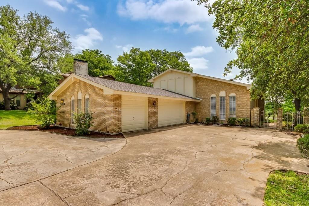9310 Waterview Road Dallas, TX 75218 - Photo 2 of 35 a view of a house with a yard and large tree