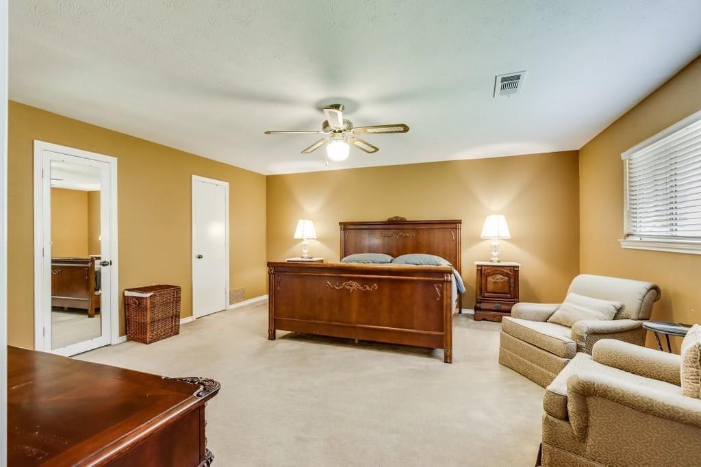 9310 Waterview Road Dallas, TX 75218 - Photo 27 of 35 a bedroom with a bed and window