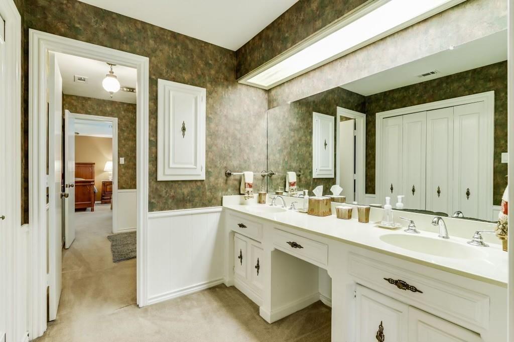 9310 Waterview Road Dallas, TX 75218 - Photo 28 of 35 a spacious bathroom with a double vanity sink mirror and