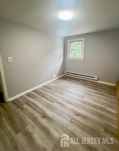 213 Temple Way, Unit 2 Colonia, NJ 07067 - Photo 14 of 16 a view of an empty room with a window