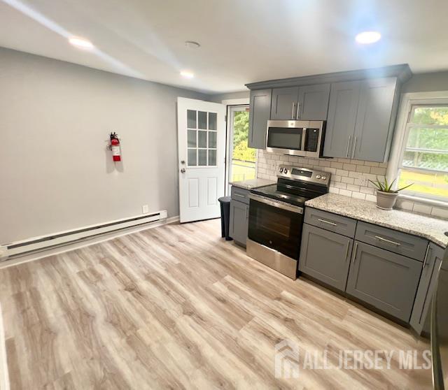 213 Temple Way, Unit 2 Colonia, NJ 07067 - Photo 3 of 16 a kitchen with granite countertop a sink stainless steel appliances and cabinets