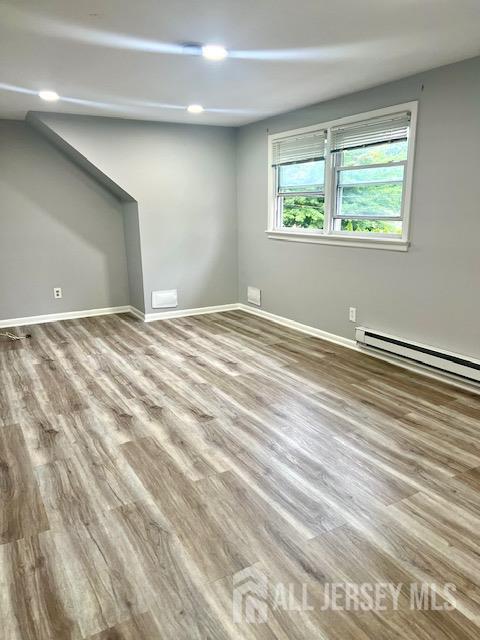 213 Temple Way, Unit 2 Colonia, NJ 07067 - Photo 5 of 16 a view of an empty room with a window