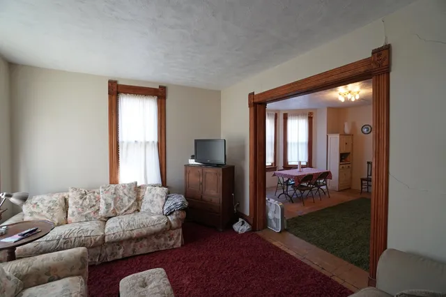a living room with furniture and a gate