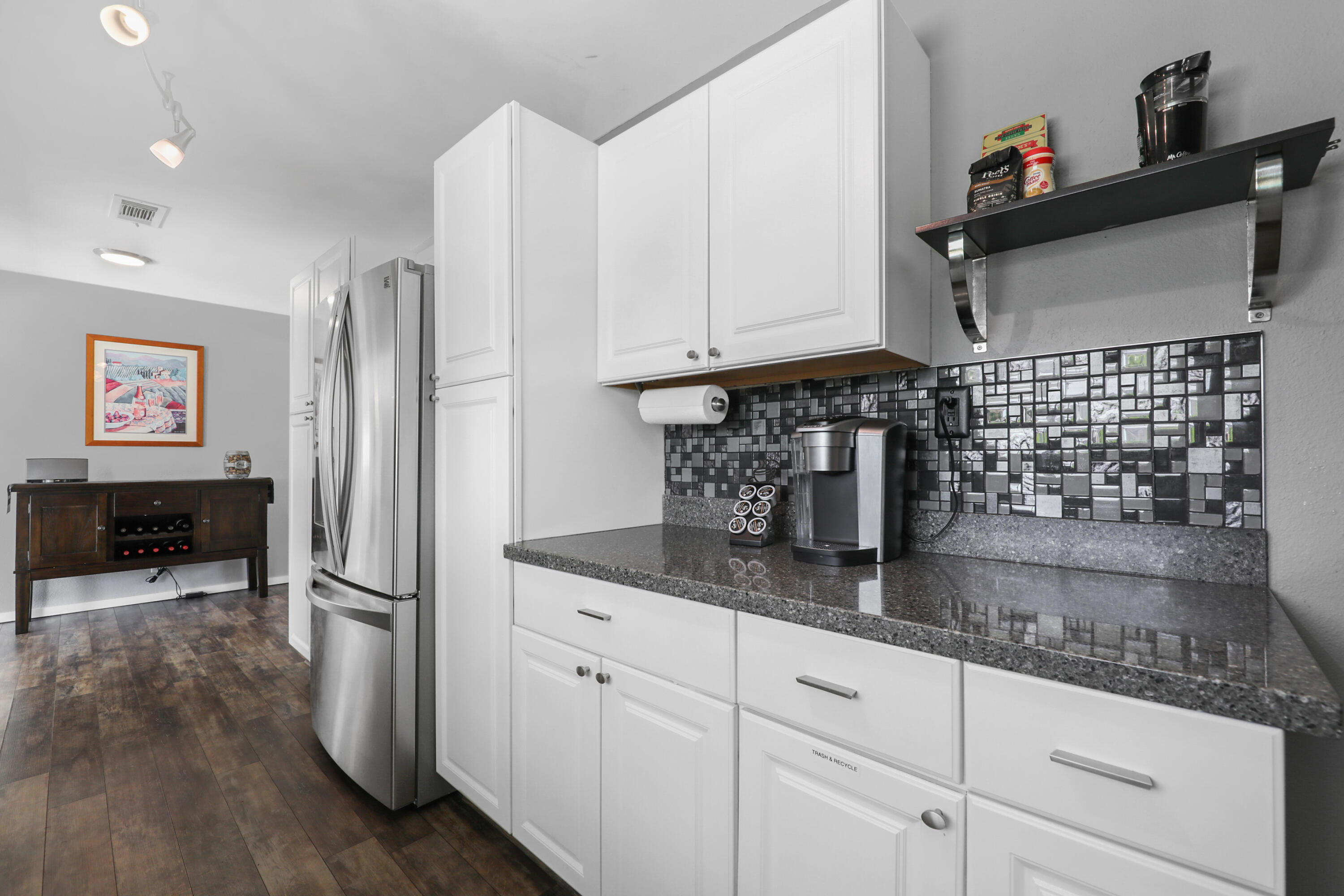 70171 Chappel Road Rancho Mirage, CA 92270 - Photo 14 of 38 a kitchen with kitchen island granite countertop a refrigerator and a sink