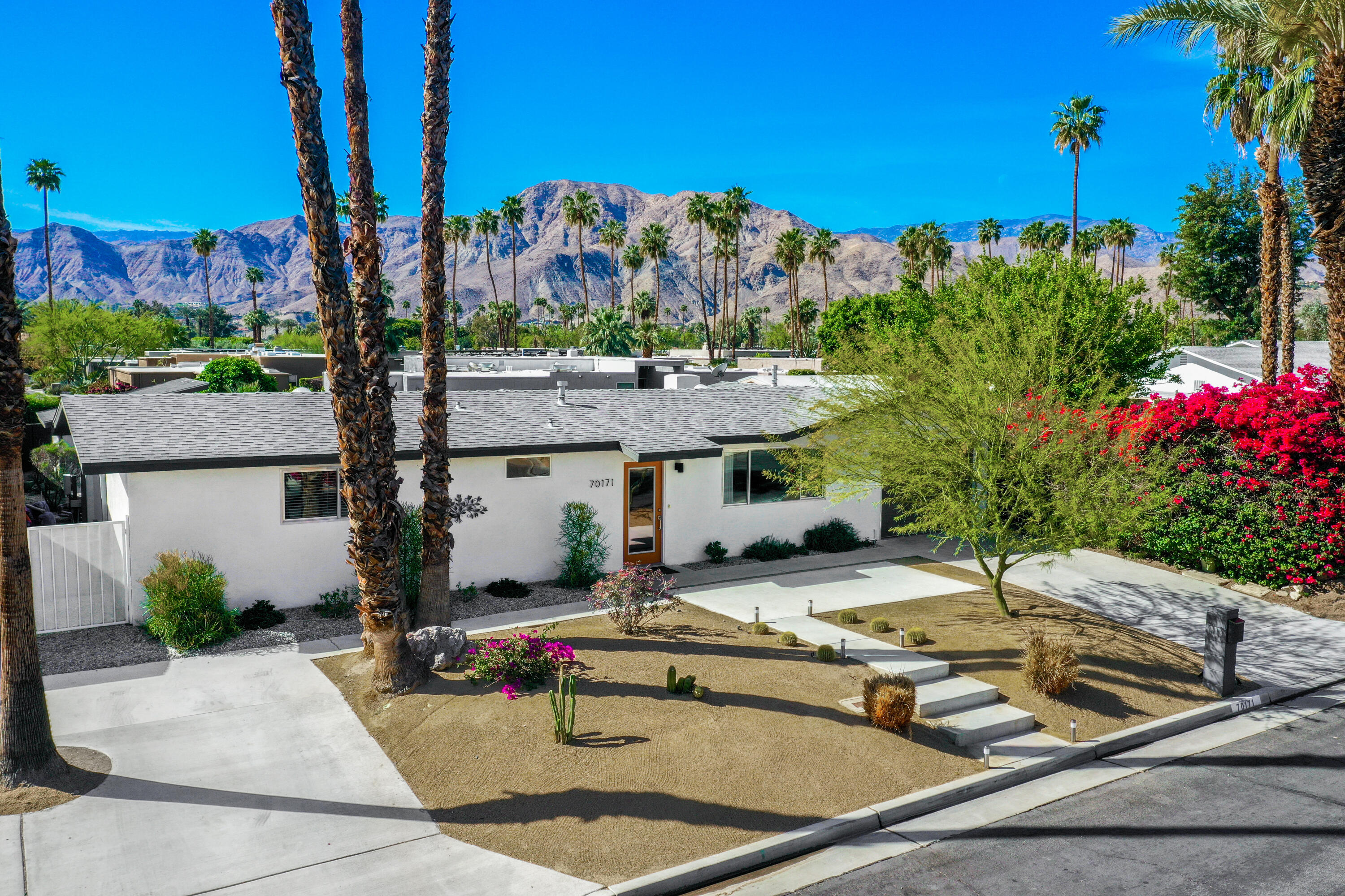 70171 Chappel Road Rancho Mirage, CA 92270 - Photo 2 of 38 a view of a swimming pool with a patio and a fire pit