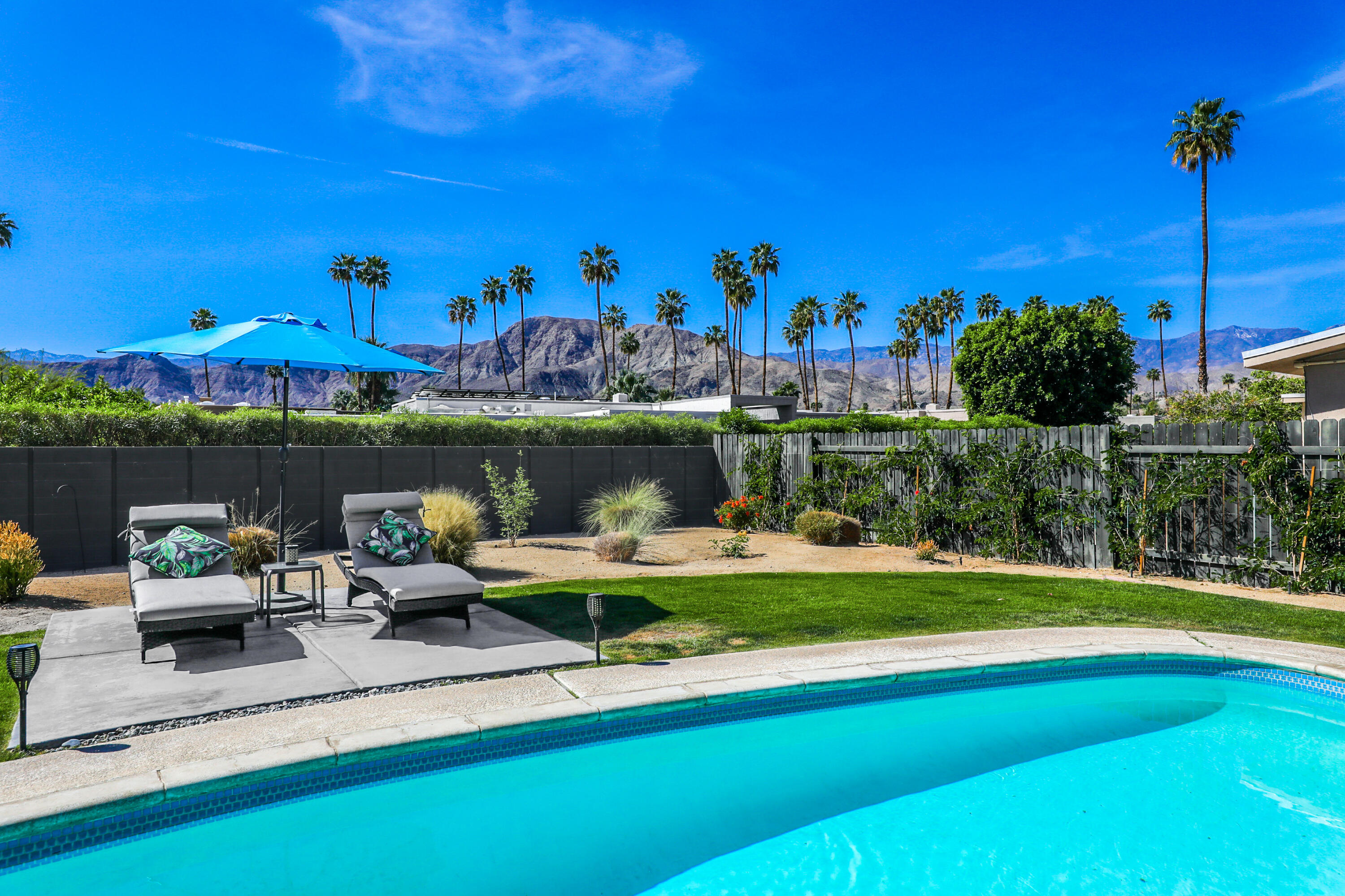 70171 Chappel Road Rancho Mirage, CA 92270 - Photo 31 of 38 a view of a fountain with a lake in the background