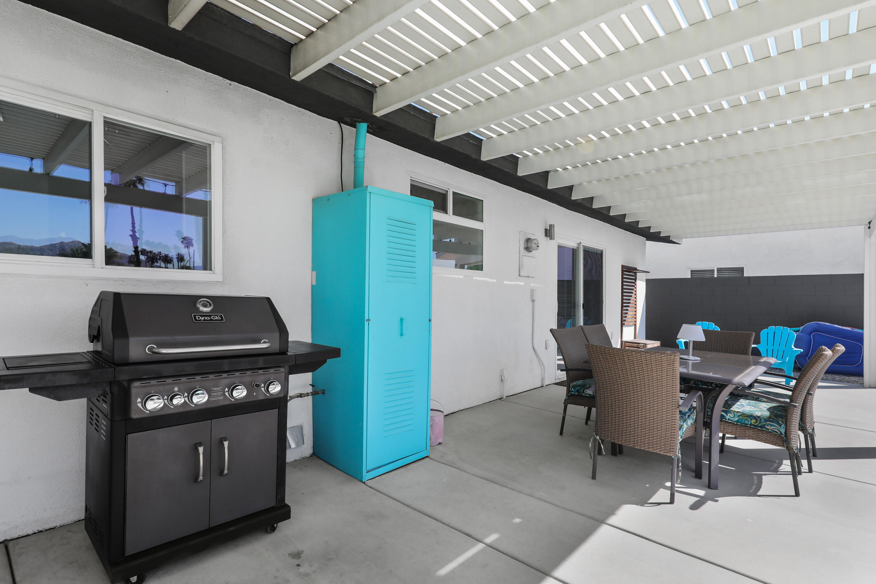 70171 Chappel Road Rancho Mirage, CA 92270 - Photo 33 of 38 a kitchen with stainless steel appliances granite countertop a stove a refrigerator and a dining table