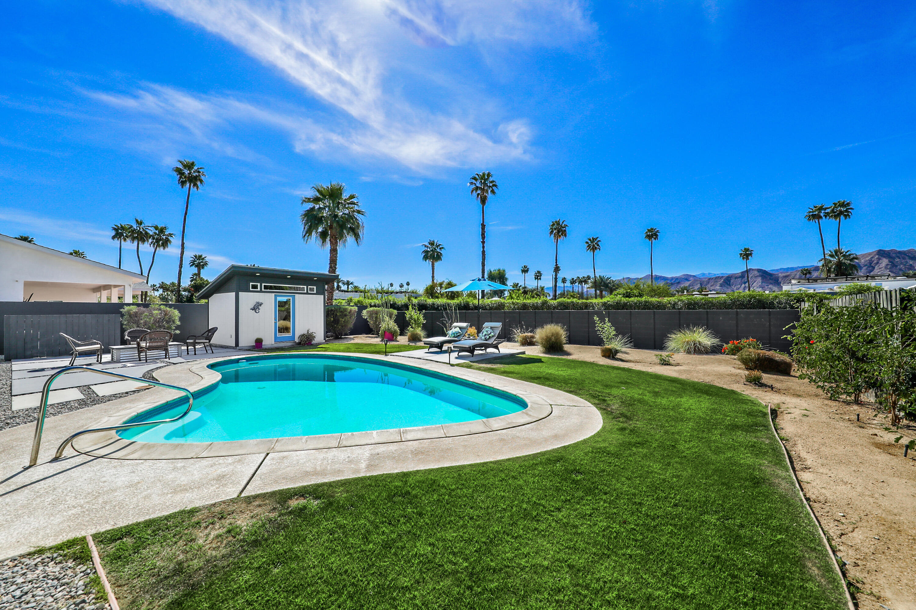70171 Chappel Road Rancho Mirage, CA 92270 - Photo 6 of 38 a view of a swimming pool and lounge chairs