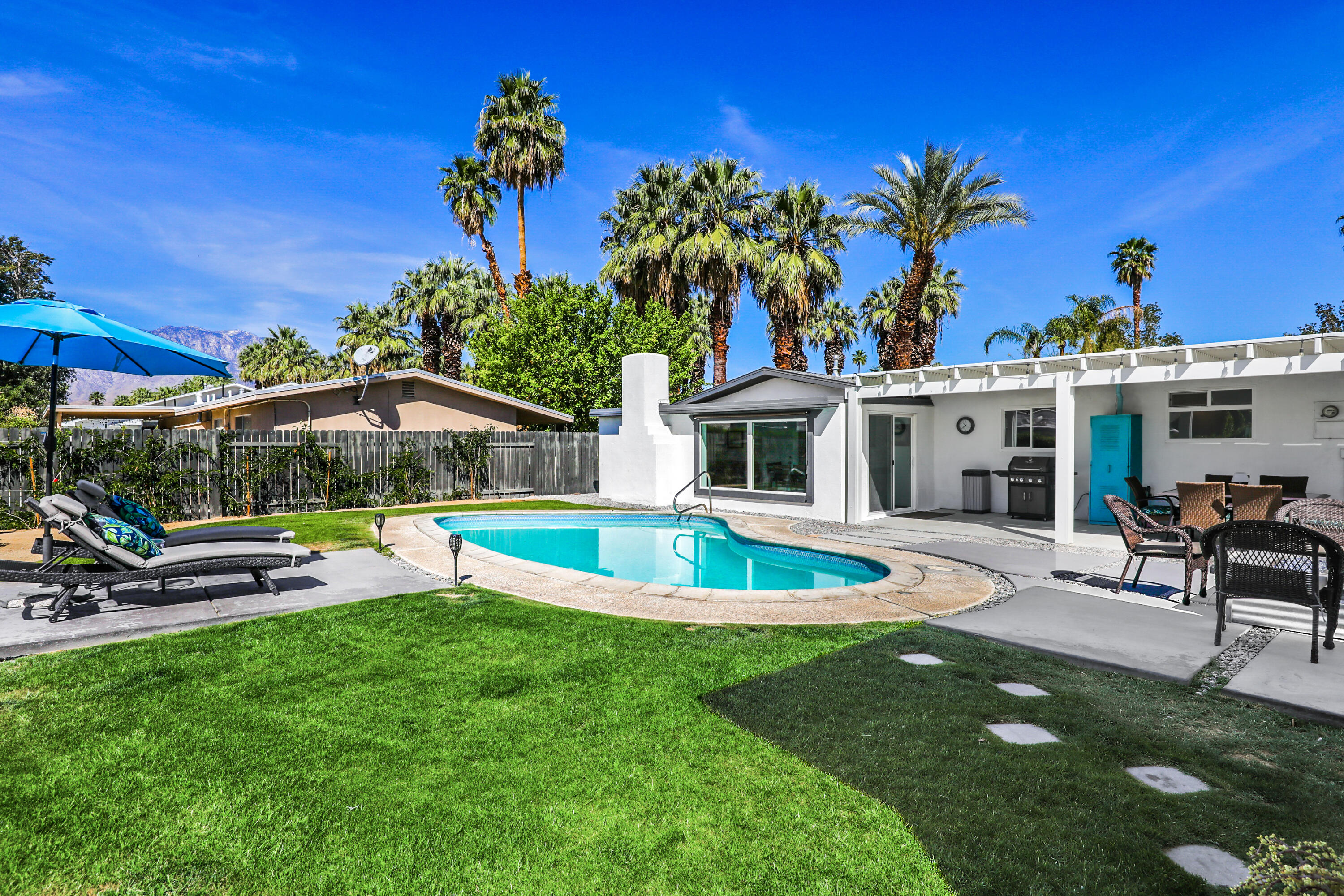 70171 Chappel Road Rancho Mirage, CA 92270 - Photo 7 of 38 a view of a house with swimming pool and sitting area