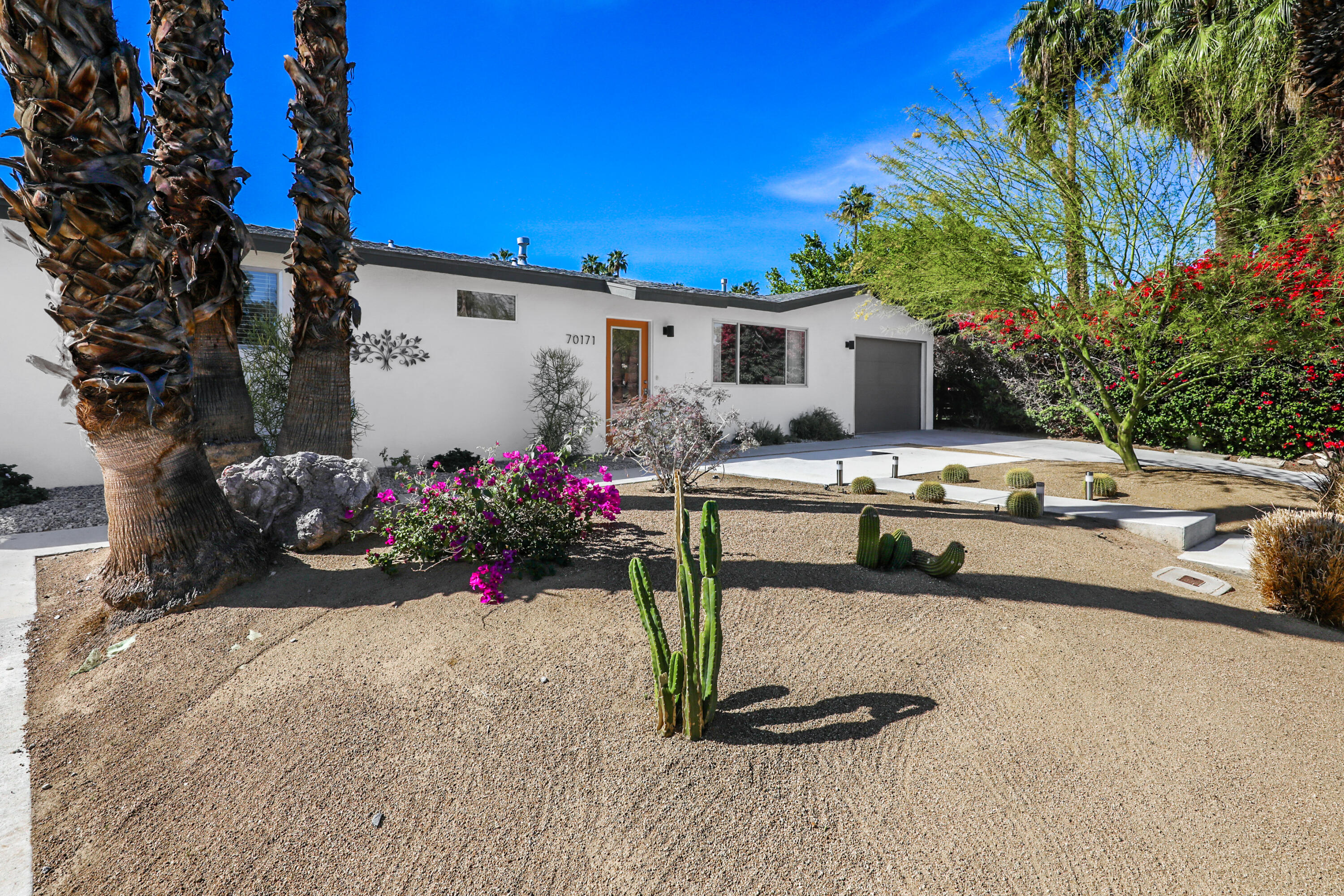 70171 Chappel Road Rancho Mirage, CA 92270 - Photo 8 of 38 a view of a white house with a yard