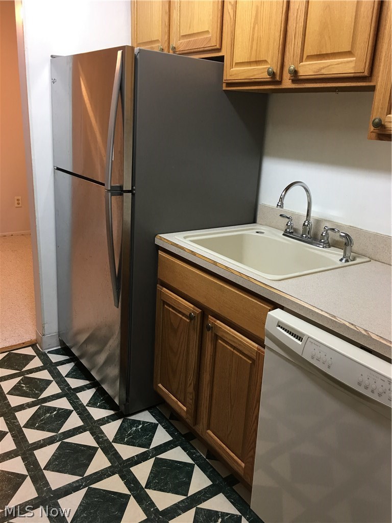 4940 Friar Road, Unit D Stow, OH 44224 - Photo 6 of 23 In the kitchen you will find a stainless refrigerator, less than 2 years young. All appliances will gift to the new owners. Home warranty protection will give the new owners a full year of protection for those appliances.