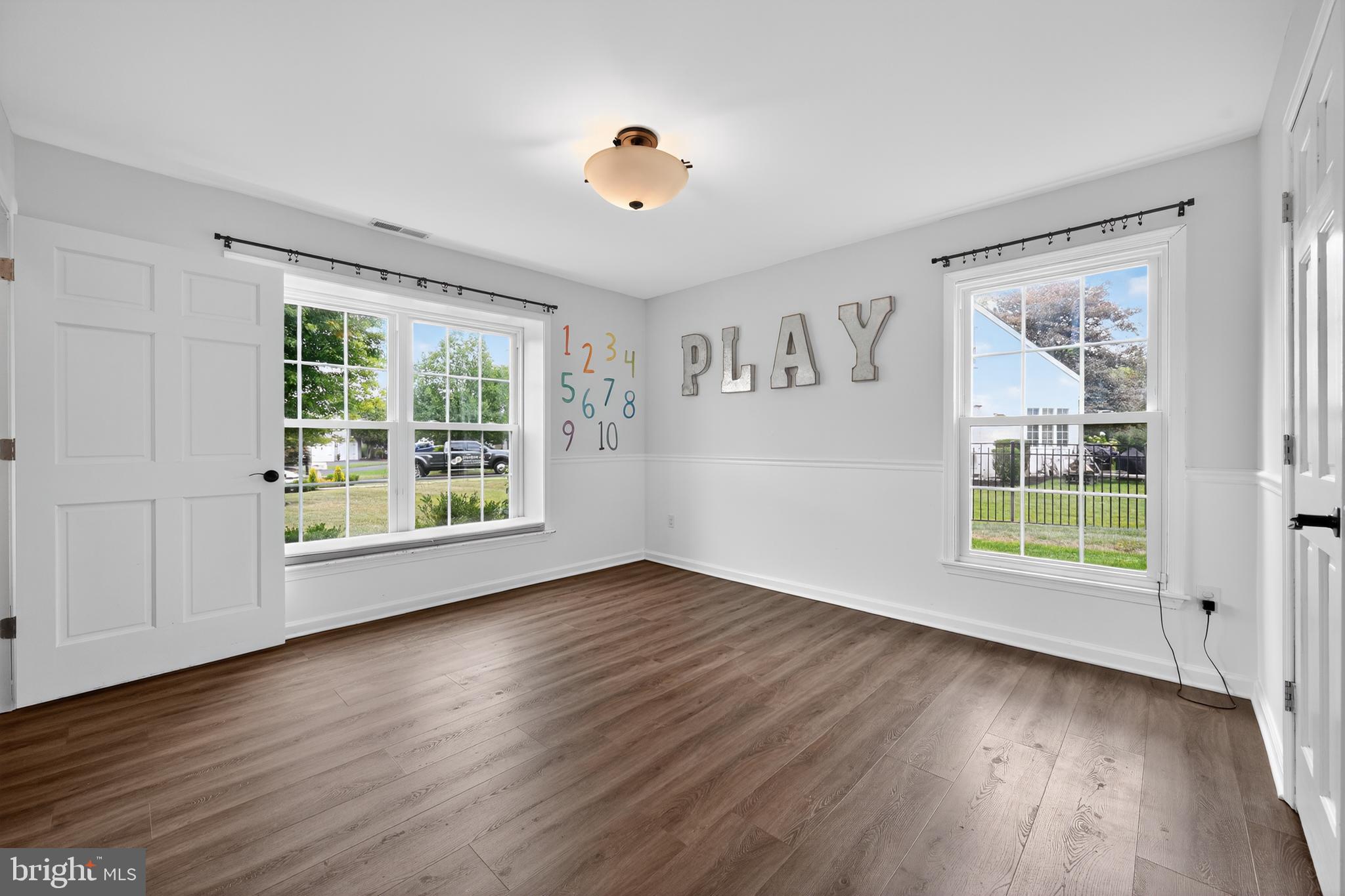 1656 South Ash Circle Jamison, PA 18929 - Photo 13 of 30 a view of an empty room with wooden floor and a window