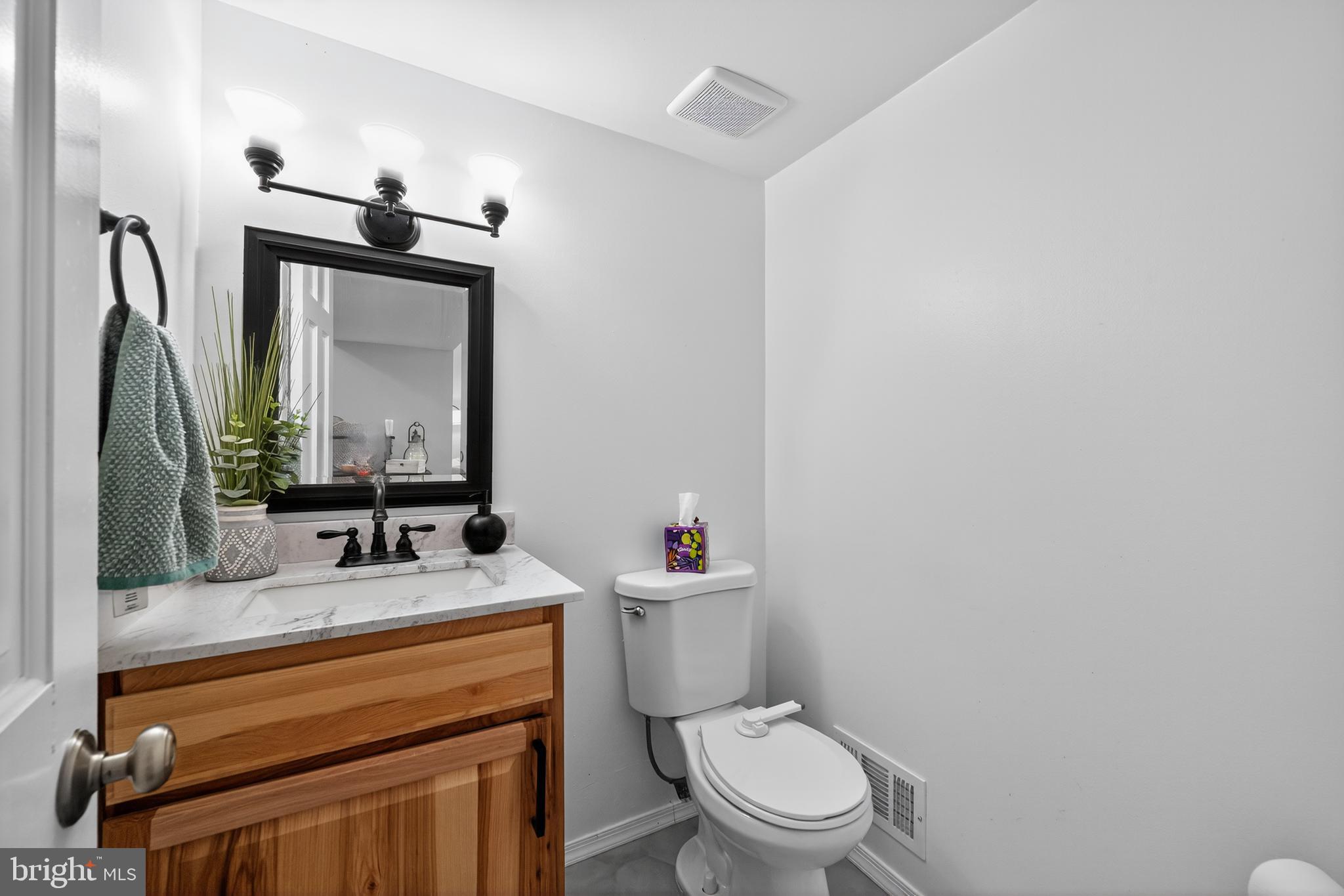 1656 South Ash Circle Jamison, PA 18929 - Photo 15 of 30 a bathroom with a toilet sink and mirror