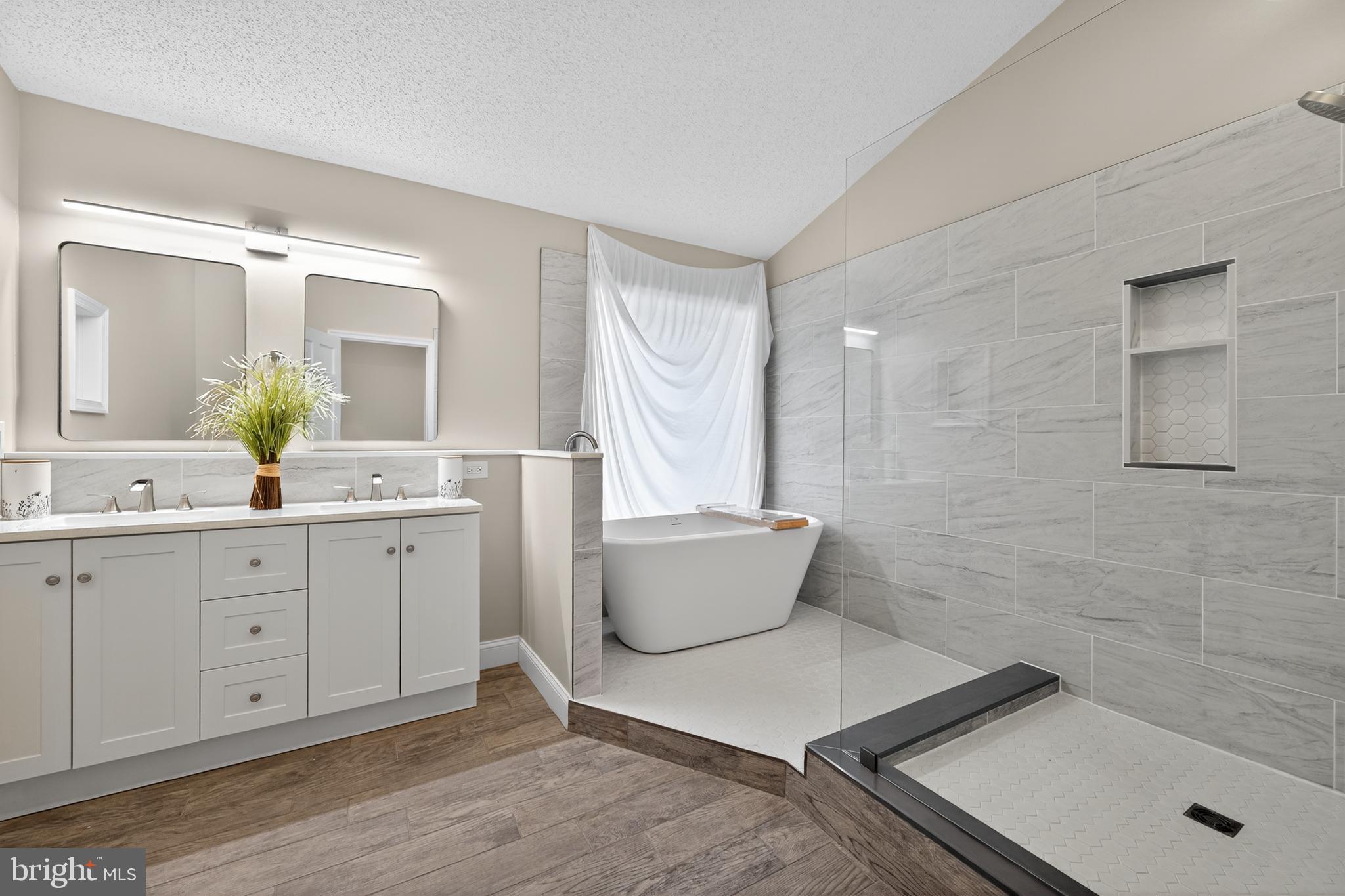 1656 South Ash Circle Jamison, PA 18929 - Photo 21 of 30 a spacious bathroom with a tub sink and mirror