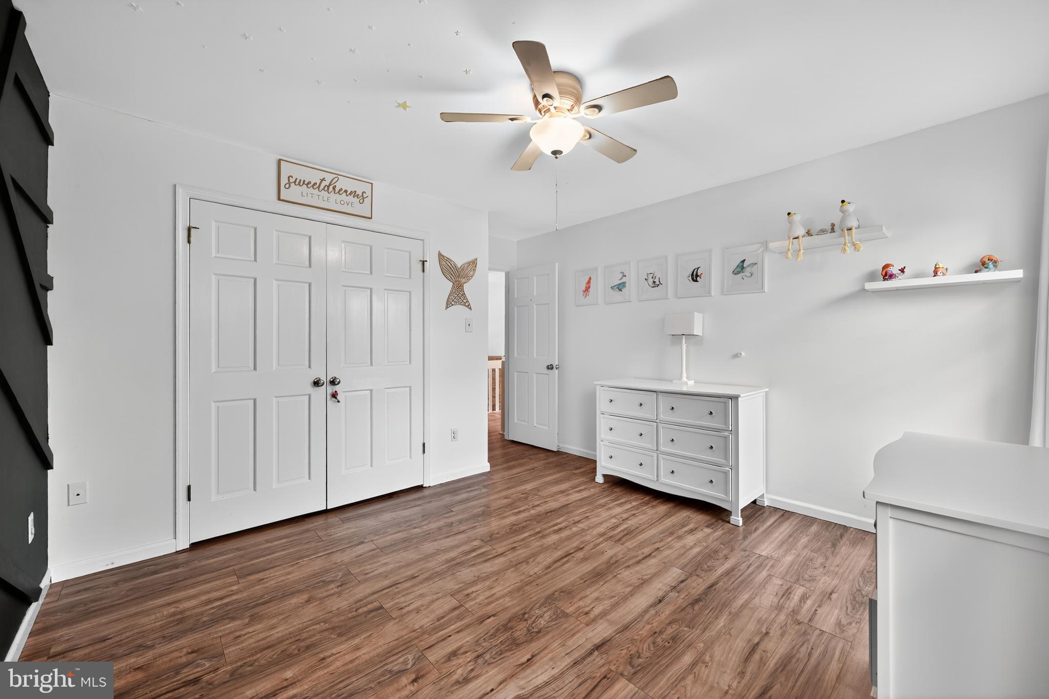 1656 South Ash Circle Jamison, PA 18929 - Photo 23 of 30 a view of a hallway with wooden floor and cabinet