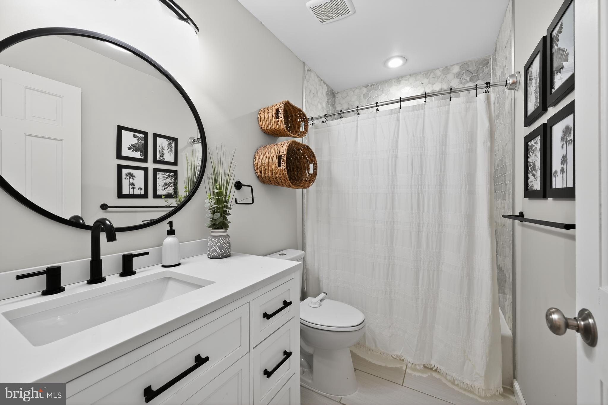 1656 South Ash Circle Jamison, PA 18929 - Photo 25 of 30 a bathroom with a toilet sink and mirror