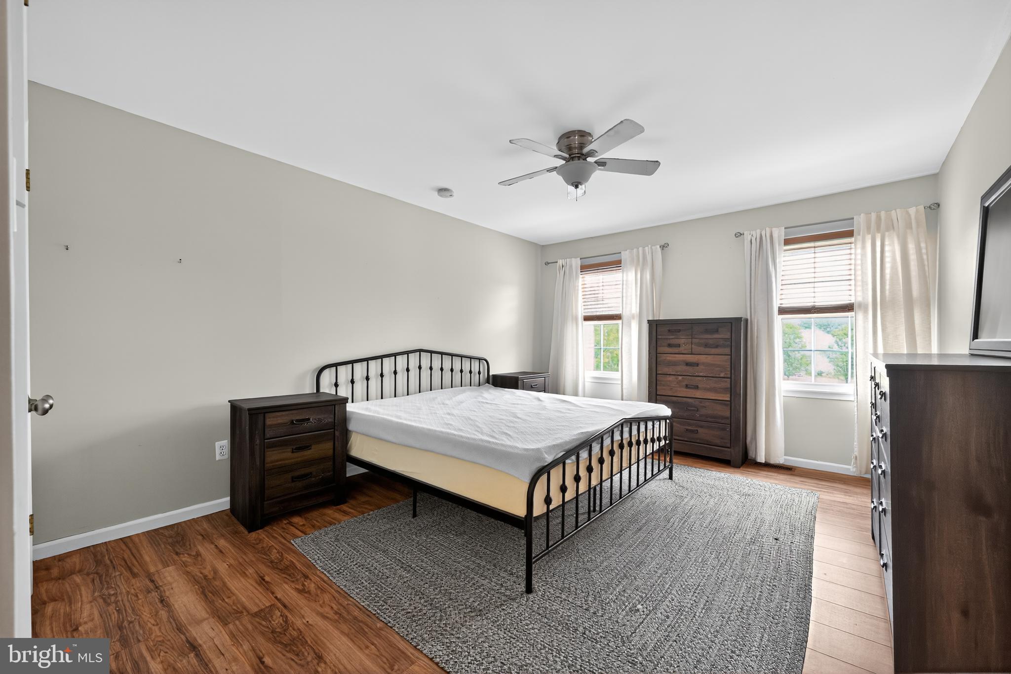 1656 South Ash Circle Jamison, PA 18929 - Photo 26 of 30 a living room with a bed furniture and a flat screen tv