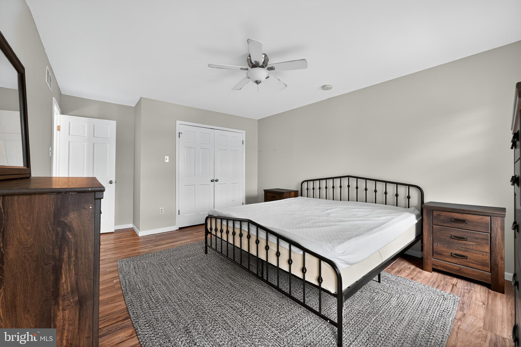 1656 South Ash Circle Jamison, PA 18929 - Photo 27 of 30 a bedroom with a bed and wooden floor