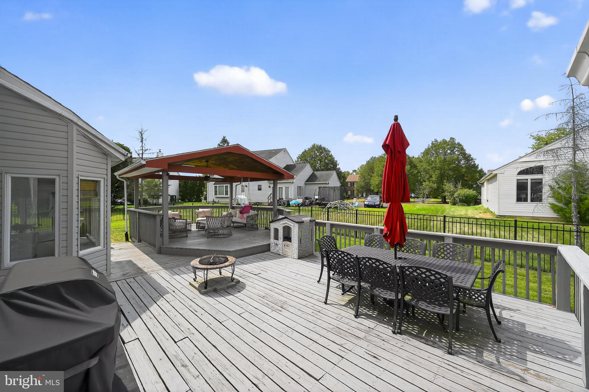 1656 South Ash Circle Jamison, PA 18929 - Photo 28 of 30 a view of a patio with couches chairs and table with wooden floor