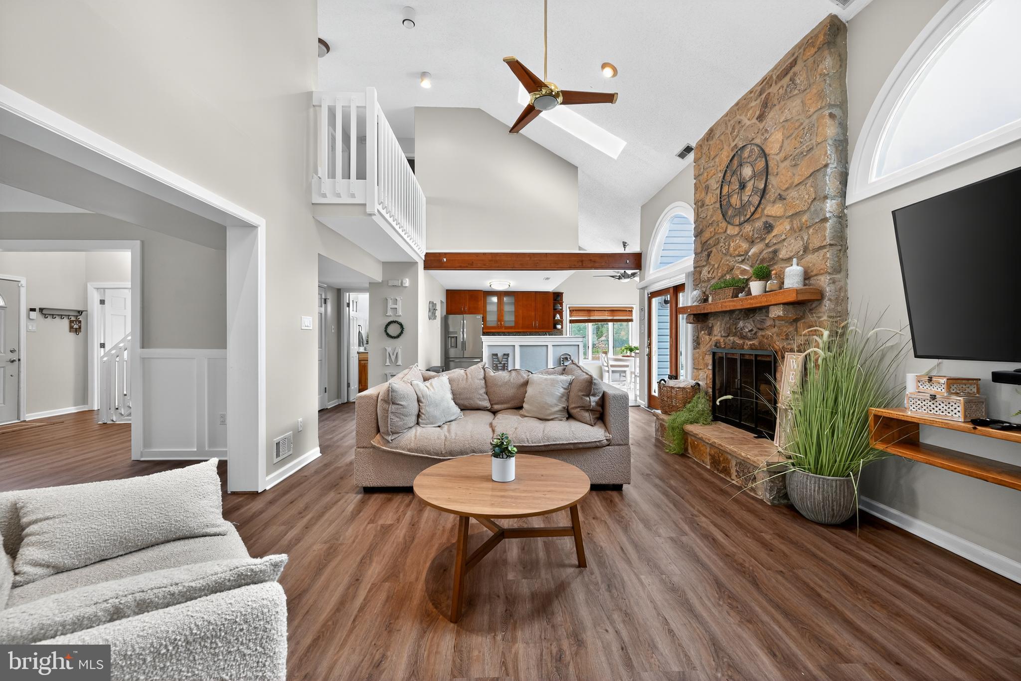 1656 South Ash Circle Jamison, PA 18929 - Photo 6 of 30 a living room with furniture a flat screen tv and a fireplace