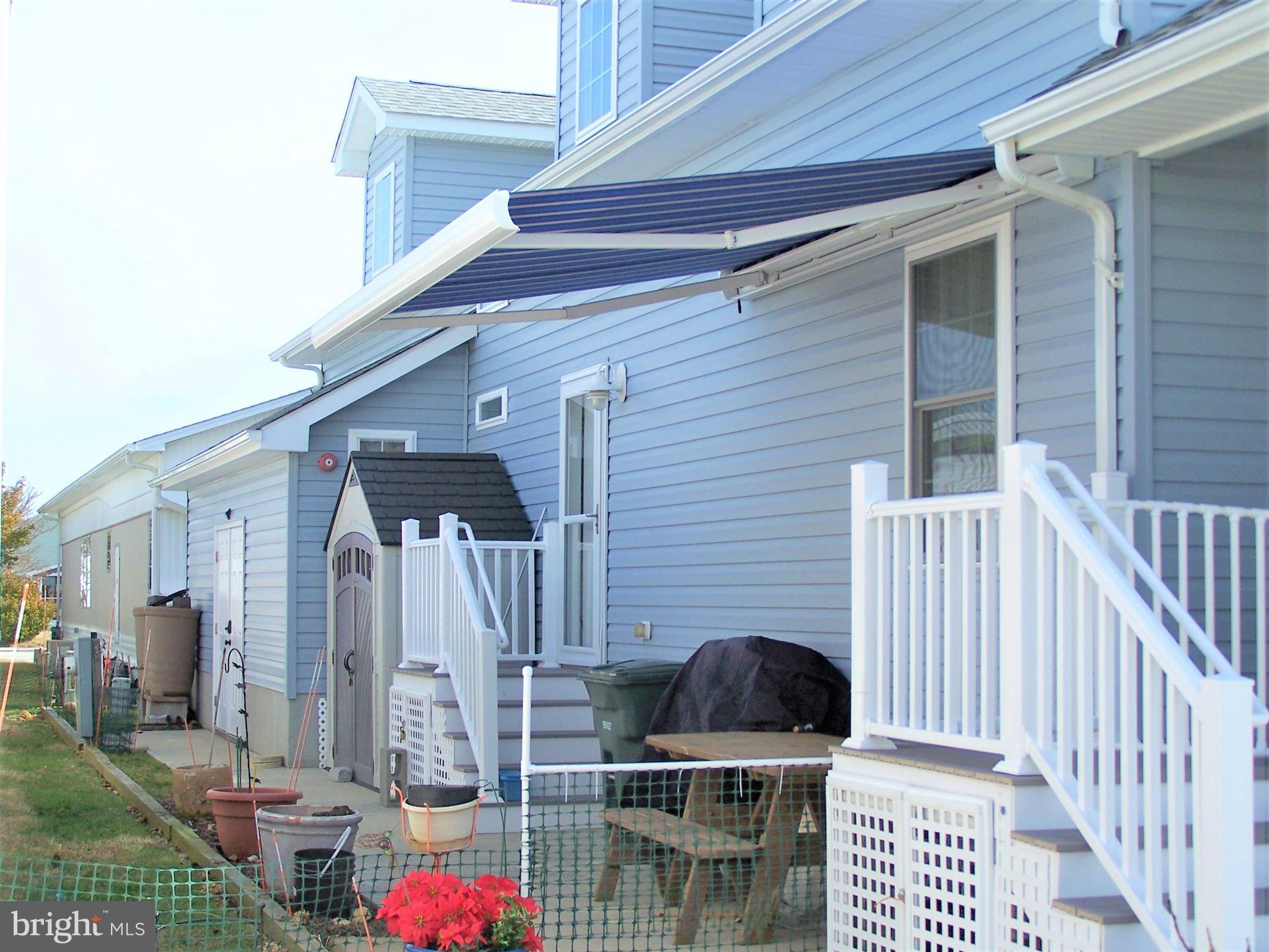 13308 Nantucket Road Ocean City, MD 21842 - Photo 17 of 74 Remote Awning over Patio Area